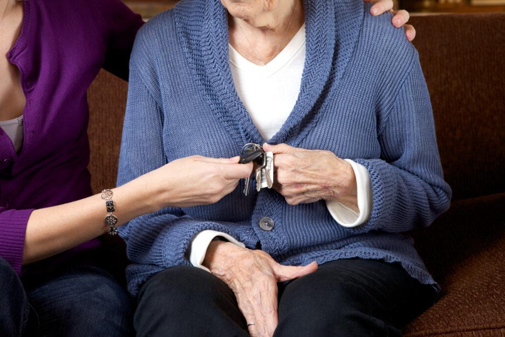 Senior woman holding car keys